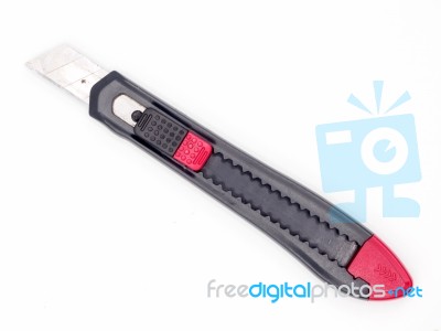 Black And Red Plastic Cutter Knife Isolated Stock Photo