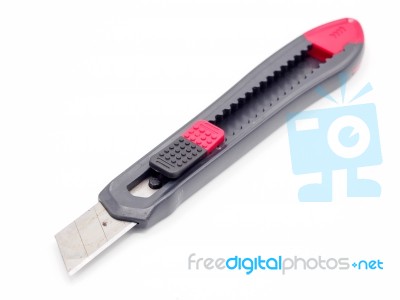 Black And Red Plastic Cutter Knife Isolated Stock Photo