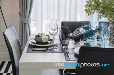 Black And White Modern Dinning Table With Table Set Stock Photo