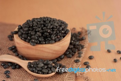 Black Bean On Wooden Stock Photo