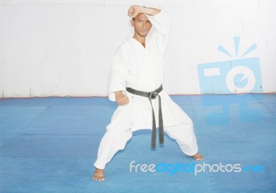 Black Belt Karate Man In Defending Position Stock Photo