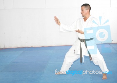 Black Belt Man In Kimono During Training Karate Kata Exercises Stock Photo