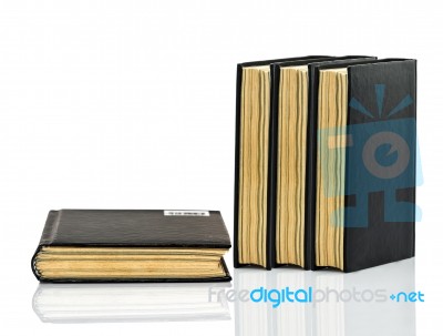 Black Book Is Laying With Shadow On White Background Stock Photo