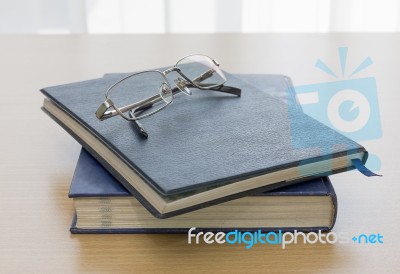 Black Book With Glasses Stock Photo