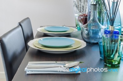 Black Dinner Table With Table Set Stock Photo