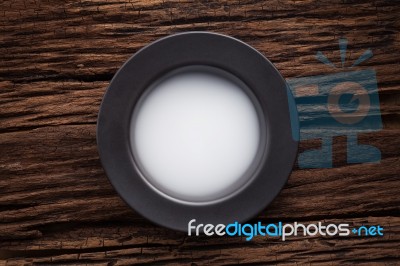 Black Empty Bowl On Wooden Table Background Stock Photo