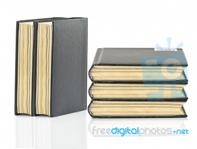 Black Hardcover Book On White Glossy Background Stock Photo