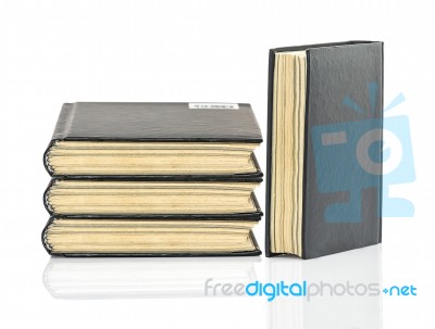 Black Hardcover Book On White Glossy Background Stock Photo