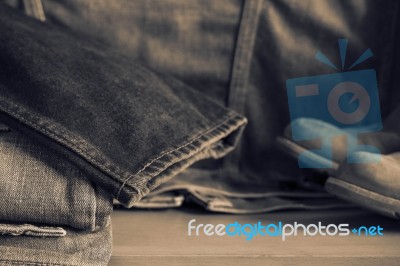 Black Jeans On Wooden Stock Photo