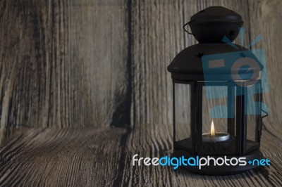 Black Lamp On Wooden Background	 Stock Photo