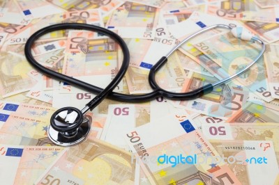 Black Professional Stethoscope Lying On Many Euro Notes Stock Photo