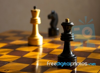 Black Queen And White King On The Chessboard Stock Photo