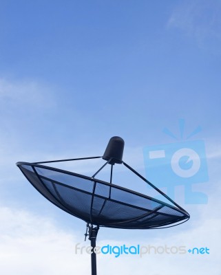 Black Satellite Dish On Blue Sky  Stock Photo