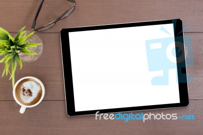 Black Tablet White Screen On Table Top View Stock Photo