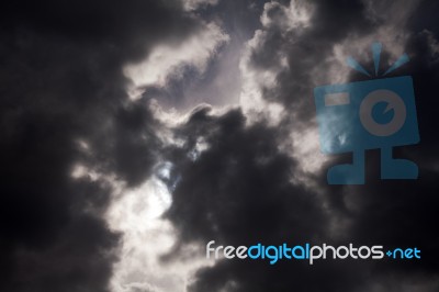 Black Thundercloud With Sunbeam Stock Photo