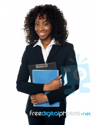 Black Woman Holding Clipboard Stock Photo