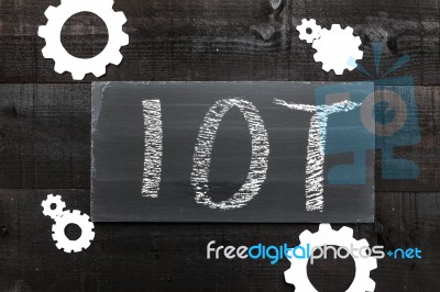 Blackboard Written With The Letters Iot, The Internet Of Things Stock Photo