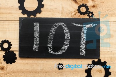 Blackboard Written With The Letters Iot, The Internet Of Things Stock Photo