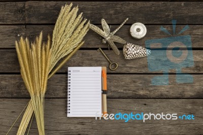 Blank Notebook With Grass Flower And Old Key Stock Photo