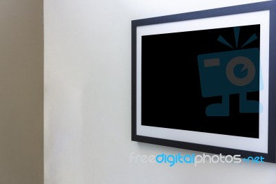 Blank Photo Frame On White Wall In Art Gallery Stock Photo