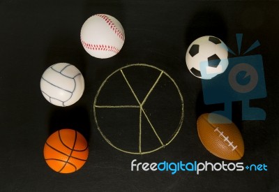 Blank Pie Chart Around With Balls In Black Background Stock Photo