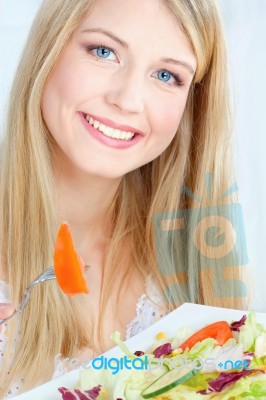 Blond Woman Eating Salad Stock Photo