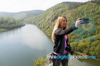 Blond Woman Taking A Selfie Stock Photo