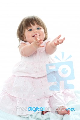 Blonde Baby Asking For Her Toys Stock Photo