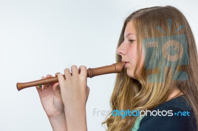 Blonde Dutch Teenage Girl Playing Flute Stock Photo