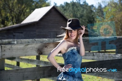 Blonde Female In Black Hat On Farm Stock Photo