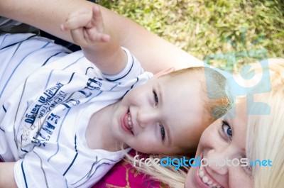 Blonde Young Mother Posing With Her Baby Stock Photo