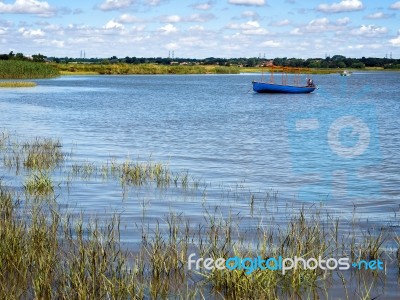 Blue Boat On The River Alde In Suffolk Stock Photo