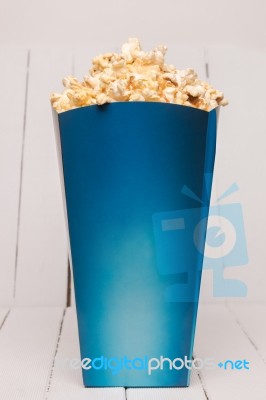 Blue Box Full Of Sweet And Tasty Popcorn Stock Photo