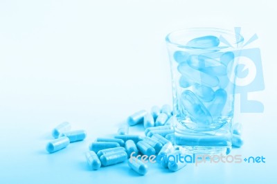 Blue Filter Medicine Capsules And Supplementary Food Stock Photo