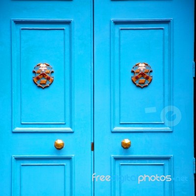 Blue Handle In London Antique Brown Door  Rusty  Brass Nail And Stock Photo