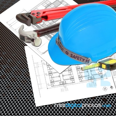 Blue Helmet Of Foreman Or Guest Constructor With Blueprints Stock Photo