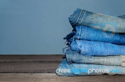 Blue Jean And Jean Lack Texture On The Wooden Floor Stock Photo