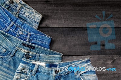 Blue Jean And Jean Lack Texture On The Wooden Floor Stock Photo