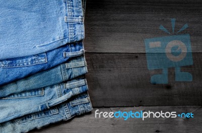 Blue Jean And Jean Lack Texture On The Wooden Floor Stock Photo