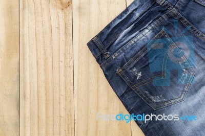 Blue Jeans On Wood Background, Fashion Stock Photo