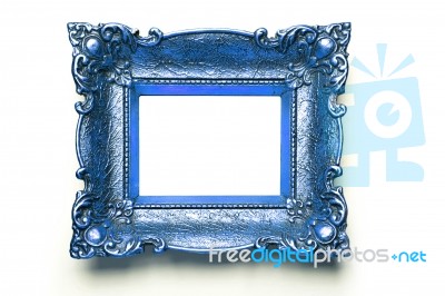 Blue Picture Frame On White Wall Stock Photo