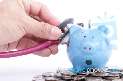 Blue Piggy Bank With Stethoscope Stock Photo