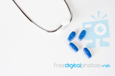 Blue Pills With Stethoscope Stock Photo