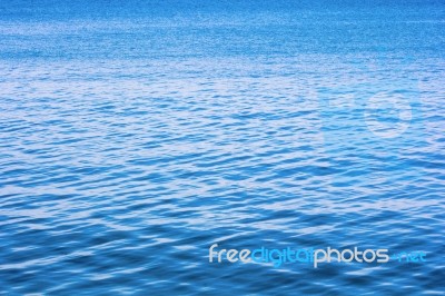 Blue Sea Water Surface On Sky Stock Photo