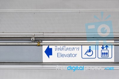 Blue Sign Elevator At Train Station Stock Photo