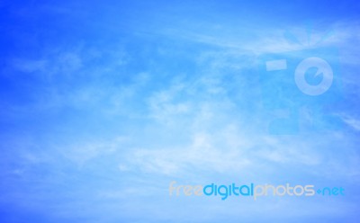 Blue Sky Background With Tiny Clouds Stock Photo