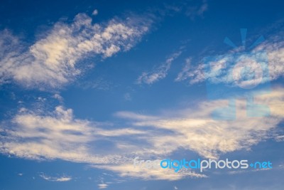 Blue Sky Background With Tiny Clouds Stock Photo