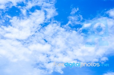 Blue Sky Background With White Clouds Stock Photo