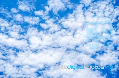 Blue Sky Background With White Clouds Stock Photo