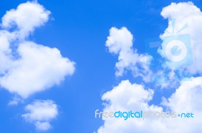 Blue Sky Background With White Clouds Stock Photo